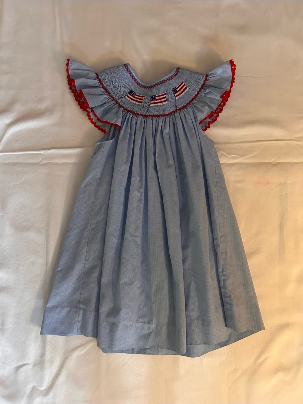 Girls' Light Blue Smocked Dress with Red Trim and Flag Embroidery